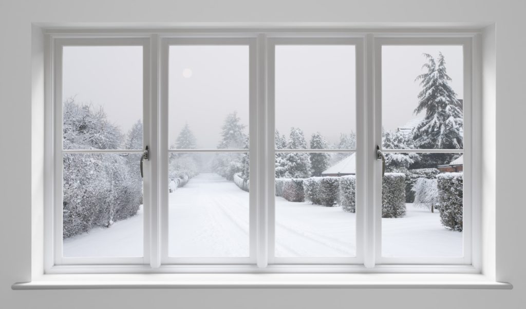 Snowy Road Through Warm Home's Window